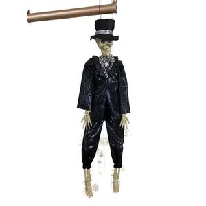 17.5” Plastic Hanging Skeleton in Black Suit & Hat Halloween Decor